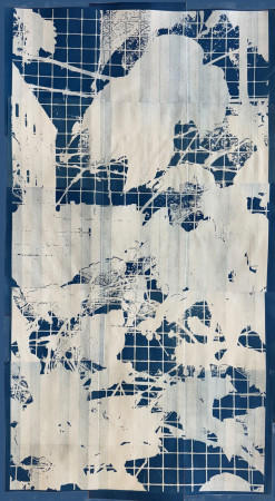 white vines and leaves across a grid of small blue squares