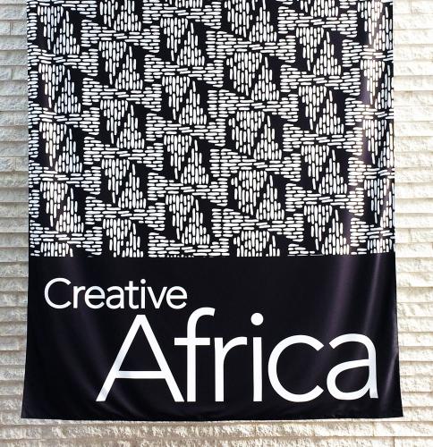 The entrance banner in the atrium of the Perelman Building at the Philadelphia Museum of Art. The black and white triangular motif announces the importance of geometric patterning in the arts of Africa.