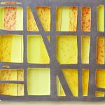 gray horizontal grid, 3 rows high, 6 rows wide, over yellow rectangles in range of tones. Bounty's Glow by Bill Brookover