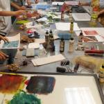 the studio work table with inks and tools shared by the class